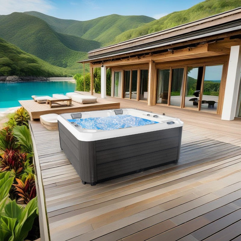 Hydra 215 Jacuzzi extérieur sur une terrasse avec vue sur les montagnes.