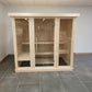 Grand sauna intérieur en bois avec portes en verre trempé.